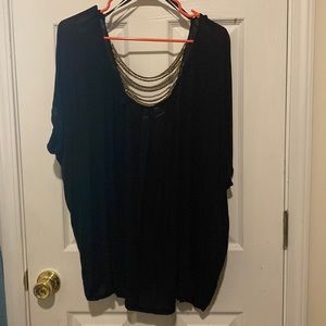 Cute black top with open back and golden beads